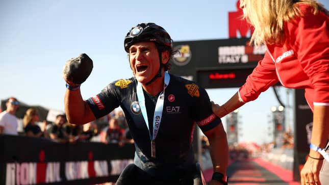 Alex Zanardi celebrates finishing IRONMAN Italy on September 21, 2019 in Cervia, Italy.