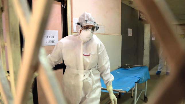 Health officials in full protective gear walk inside an isolation ward of Ernakulam Medical College in Kerala on June 6, 2019. The 2019 outbreak ultimately involved only one reported case, who successfully recovered. 