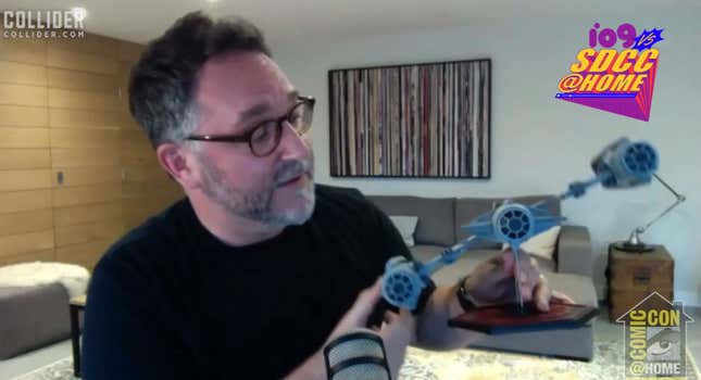 Colin Trevorrow with a one-of-a-kind TIE Fighter designed for his version of Star Wars.