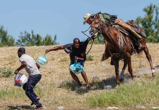 Image for article titled How a Photo Tells Us Everything We Need to Know About America and Haitian Migrants