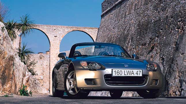 A photo of a silver Honda S2000 sports car. 