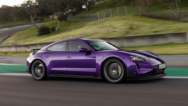 Front 3/4 view of a purple Porsche Taycan Turbo GT driving on track