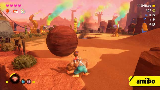 A giant ball sits before Donkey Kong and his friend.