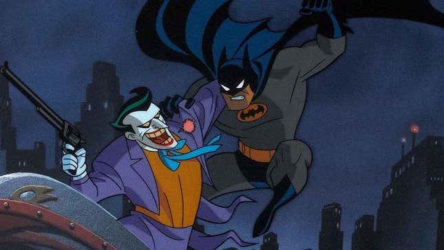 Batman attacks the joker on the rooftops of Gotham