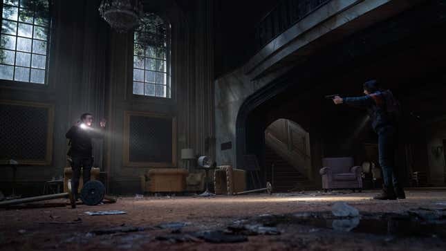 Dina aims a gun at Ellie, who has her hands raised on the other side of a theater lobby.