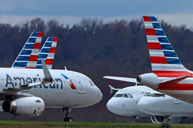 FILE - American Airlines planes sit stored at Pittsburgh International Airport on March 31, 2020, in Imperial, Pa. There will be no strike by American Airlines flight attendants around the Christmas and New Year&#39;s holidays. The National Mediation Board instead directed the airline and the Association of Professional Flight Attendants to keep negotiating over a new contract. (AP Photo/Gene J. Puskar, File)