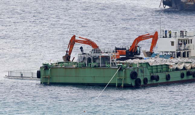 A reclamation work is resumed at a construction site off Henoko in Nago, Okinawa prefecture, southern Japan Wednesday, Jan. 10, 2024. Japan&#39;s central government on Wednesday forcibly resumed reclamation work at the planned relocation site of a disputed U.S. military base on the southern island of Okinawa despite persistent opposition and protests by residents and amid growing international criticisms that the move tramples on democracy and environment. (Kyodo News via AP)