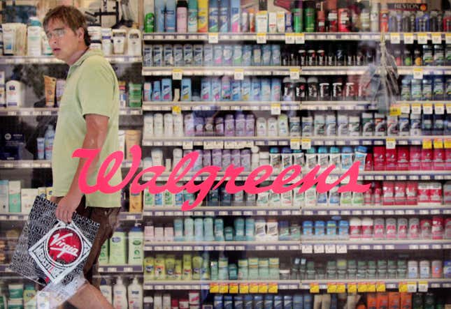 A shopper walks down an aisle at a Walgreens store along Michigan Ave in Chicago, Illinois.
