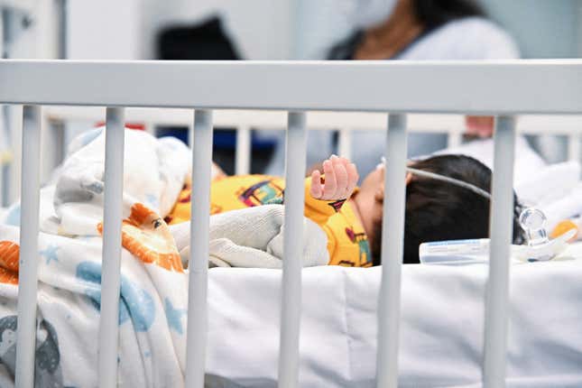 A child with RSV in a hospital bed