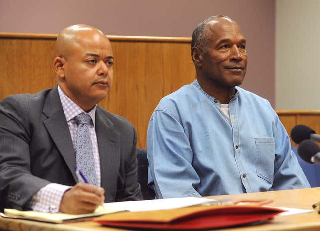 In this July, 20, 2017, file pool photo, former NFL football star O.J. Simpson appears with his attorney Malcolm LaVergne, left, during a parole hearing at the Lovelock Correctional Center in Lovelock, Nev. 