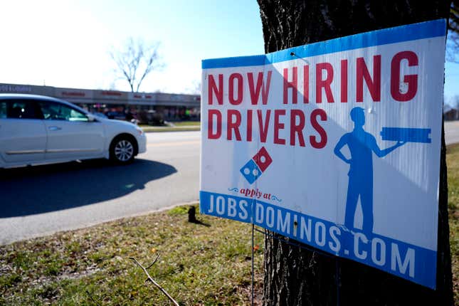 A hiring sign is posted outside of a Domino&#39;s restaurant in Wheeling, Ill., Monday, Jan. 29, 2024. On Tuesday, the Labor Department reports on job openings and labor turnover for December. (AP Photo/Nam Y. Huh)