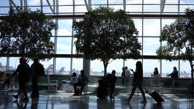 A photo of passengers walking through Charlotte airport. 