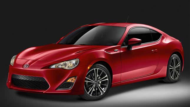 A photo of a red Scion FRS sports car in a studio. 