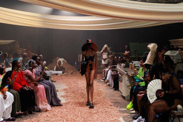 A model wearing clothes by Nigerian fashion designer Bubu Ogisi walks down the runway at her fashion show, Shadows, in Lagos on Oct. 29, 2023