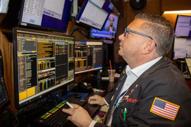 FILE - Traders work on the New York Stock Exchange floor in New York City, on Tuesday, Sept. 5, 2023. Treasury yields surged in September and sapped the energy from a strong stock market as investors came to terms with the likelihood that interest rates will remain high well into 2024. The yield on the 10-year Treasury jumped to the highest level in nearly two decades. (AP Photo/Ted Shaffrey, File)