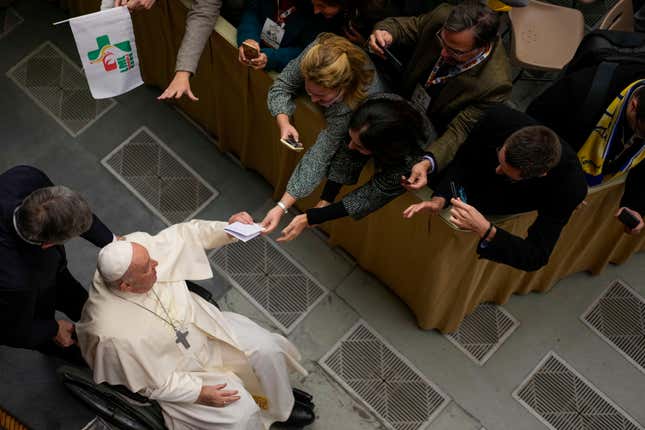 Pope Francis arrives to meet the members of the 2023 World Youth Day organizing committee, in the Pope Paul VI hall at the Vatican, Thursday, Nov. 30, 2023. (AP Photo/Andrew Medichini)