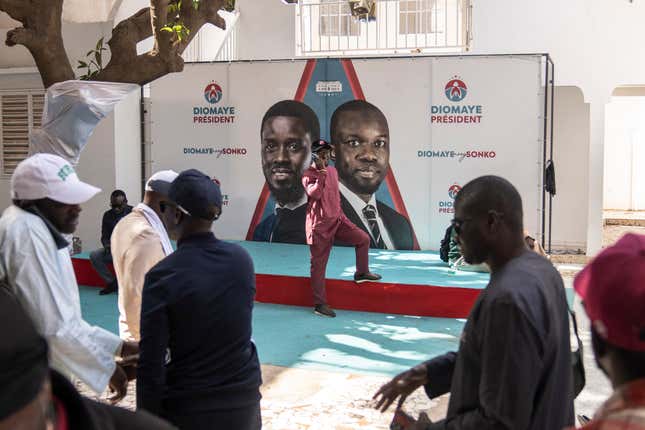 Supporters of Presidential candidate Bassirou Diomaye Faye gather at his campaign headquarters after preliminary results put him as the expected winner, in Dakar, Senegal, Monday, March 25, 2024. Faye&#39;s expected victory reflected frustration among youth with high unemployment and concerns about governance in the West African nation. Faye, backed by popular opposition leader Ousmane Sonko, has vowed to protect Senegal from corruption and interference from foreign powers like former colonial master France. (AP Photo/Mosa&#39;ab Elshamy)