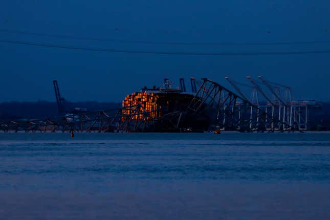 Wreckage of the Francis Scott Key Bridge rests on the container ship Dali, Sunday, March 31, 2024, in Baltimore. (AP Photo/Julia Nikhinson)