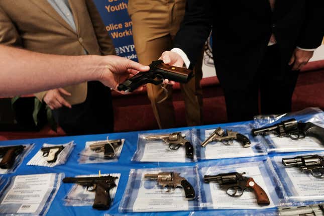 Guns are displayed on a table during a gun buy-back event at a church in Staten Island on April 24, 2021, in New York City.