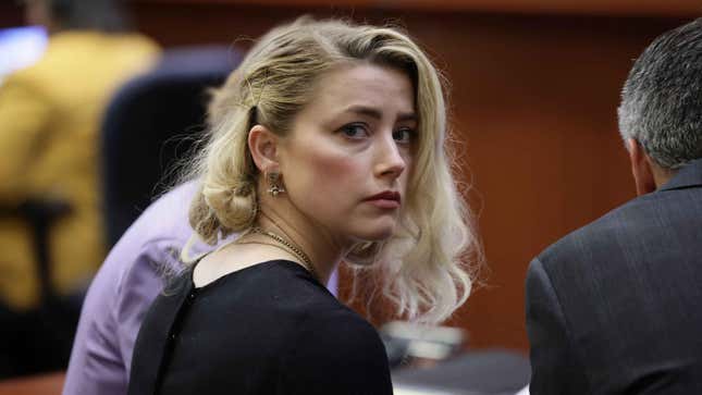 Actress Amber Heard solemnly stares at the camera while in court.