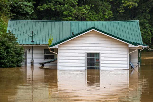 Homes are flooded by Lost Creek, Ky., on Thursday, July 28, 2022.