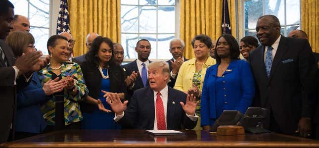 President Donald Trump prepares to sign an executive order to bolster historically black colleges and universities in the Oval Office of the White House in Washington, DC, February 28, 2017.