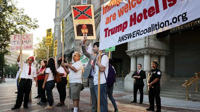 Demonstrators gather in front of the newly opened Trump International Hotel to protest against Republican presidential candidate Donald Trump and what they say are his racist, sexist and anti-immigration positions Sept. 12, 2016 in Washington, D.C.