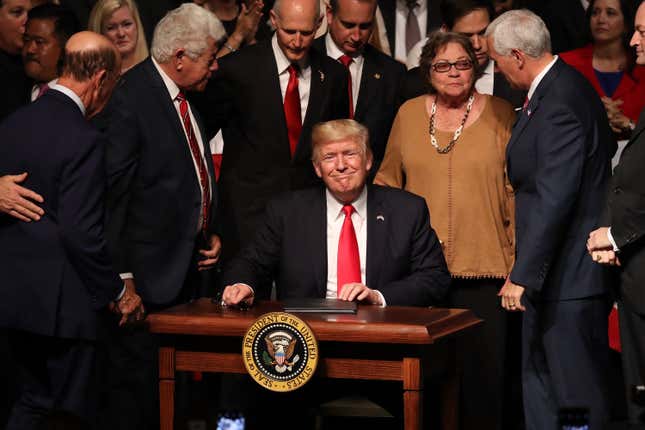 President Donald Trump smiles after signing policy changes he is making toward Cuba at the Manuel Artime Theater in the Little Havana neighborhood on June 16, 2017 in Miami, Florida.