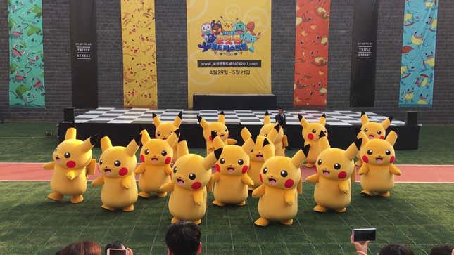 Rapidly Deflating Pikachu Rushed To Safety By Small Horde Of Suited Men