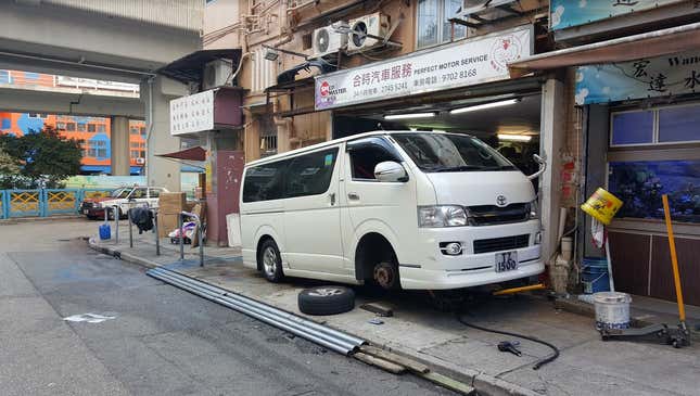 Image for article titled The Most Dedicated Mechanics In The World Wrench On The Streets Of Hong Kong