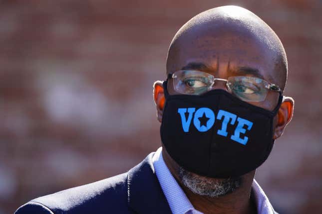 Democratic U.S. Senate candidate Rev. Raphael Warnock is seen at a campaign event on October 3, 2020 in Lithonia, Georgia. Warnock is hoping to unseat incumbent Kelly Loeffler. 