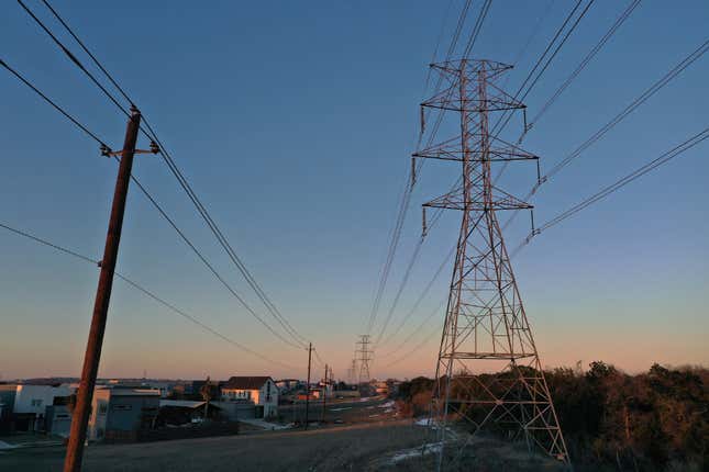  An aerial view from a drone shows electrical power lines running through a neighborhood on February 19, 2021 in Austin, Texas. Amid days of nationwide frigid winter storms in which 58 people died, more than 4 million Texans were without power for much of the past week, with about 13 million Texans being forced to boil tap water in the aftermath of the strain on infrastructure. 