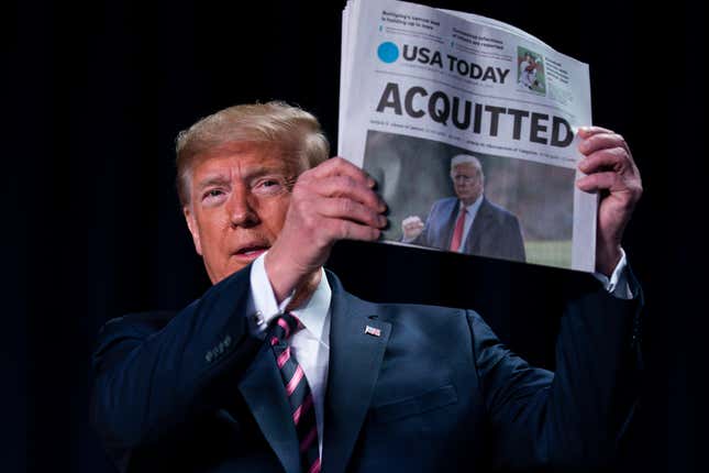 Image for article titled Insufferable Trump Holds Up Newspaper With ‘Acquitted’ Headline and Blasts Dems During National Prayer Breakfast