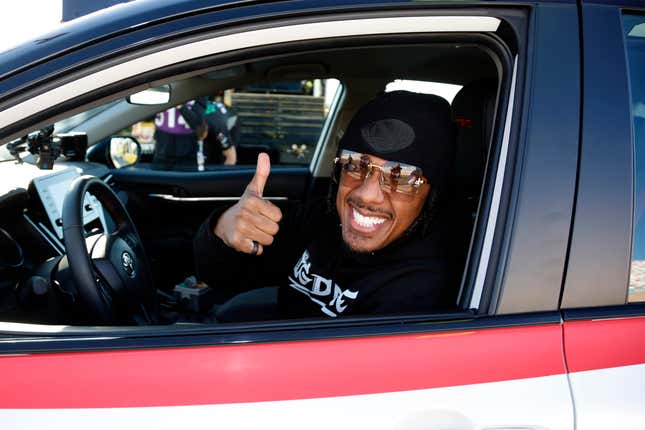 LAS VEGAS, NEVADA - OCTOBER 15: Honorary pace car driver, Nick Cannon poses for photos during pace car training prior to the NASCAR Cup Series South Point 400 at Las Vegas Motor Speedway on October 15, 2023 in Las Vegas, Nevada.
