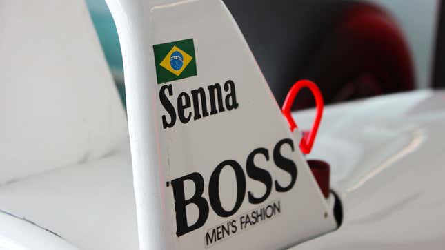 A photo of Ayrton Senna's name badge on a McLaren F1 car. 