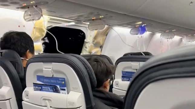 This image from video provided by Elizabeth Le shows passengers near the damage on an Alaska Airlines Boeing 737 Max 9, Flight 1282, which was forced to return to Portland International Airport on Friday, Jan. 5, 2024.