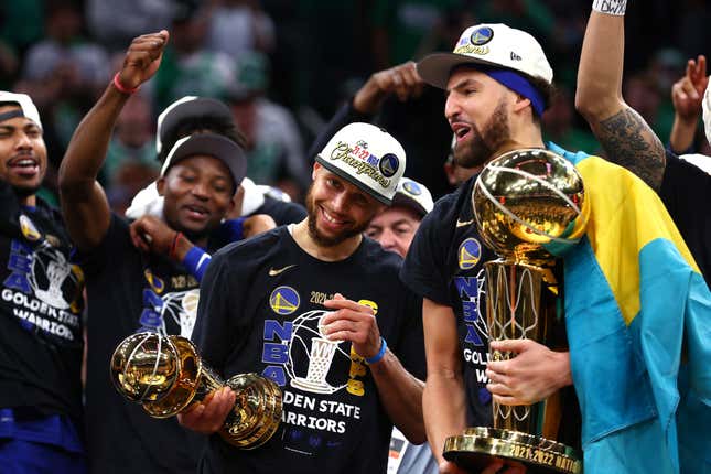 BOSTON, MASSACHUSETTS - JUNE 16: Stephen Curry #30 and Klay Thompson #11 of the Golden State Warriors celebrate after defeating the Boston Celtics 103-90 in Game Six of the 2022 NBA Finals at TD Garden on June 16, 2022 in Boston, Massachusetts. NOTE TO USER: User expressly acknowledges and agrees that by downloading and/or using this photo, User agrees to the terms and conditions of the Getty Images License Agreement. (Photo by Elsa/Getty Images)