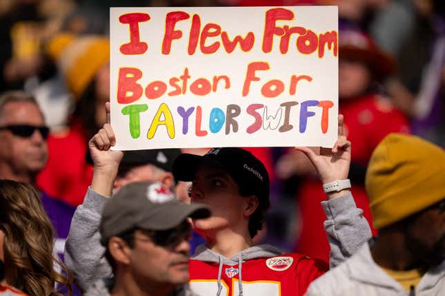 Taylor Swift fan holds placard in a NFL match