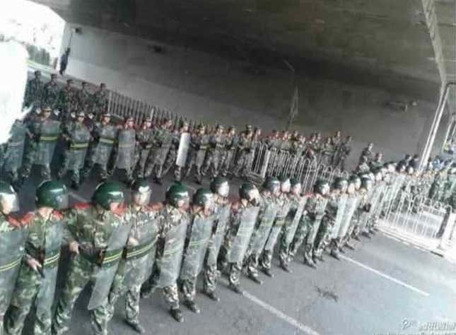 Police block the road in the outskirts of Beijing, as part of an effort to quell public demonstrations. This picture was published by Chinese pop culture blog Beijing Cream.