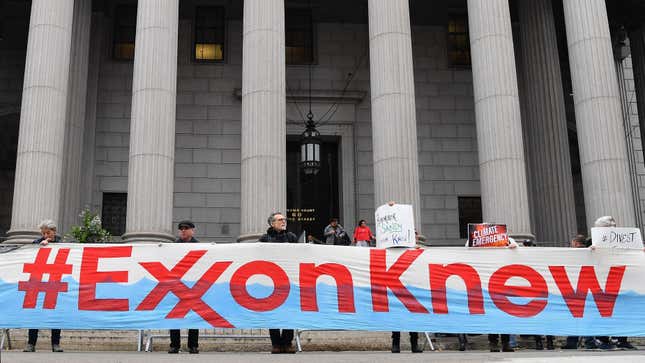 During an earlier state suit against ExxonMobil, protestors stand outside the New York State Supreme Court building in 2019.