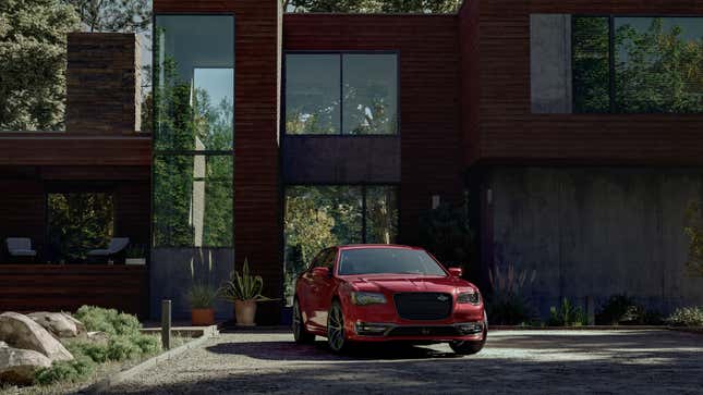 A photo of a red Chrysler 300C sedan. 