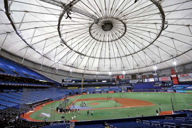 FILE - Members of the Tampa Bay Rays take batting practice at Tropicana Field before a baseball game against the Toronto Blue Jays in St. Petersburg, Fla., July 24, 2020. The Rays are pushing for swift approval of a financing deal for a new 30,000-seat ballpark, part of a much larger $6 billion redevelopment project that includes such things as affordable housing, a hotel, a Black history museum and many other items. (AP Photo/Chris O&#39;Meara, File)