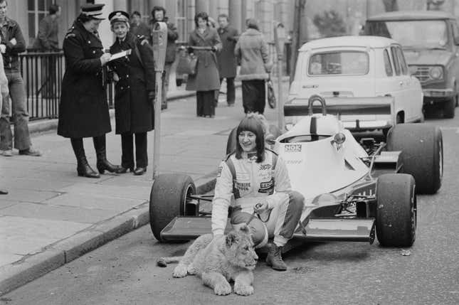 Desiré Wilson and a tiger cub pose with a Melchester Tyrrell 008