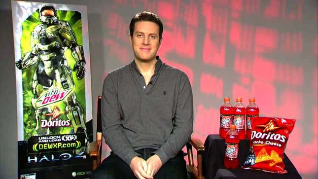 An image shows Geoff Keighley sitting between Mtn Dew bottles and bags of Doritos.
