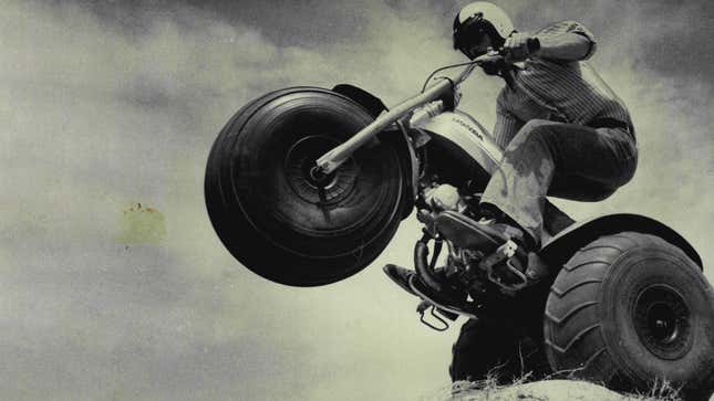 A black and white photo of a Honda trike. 