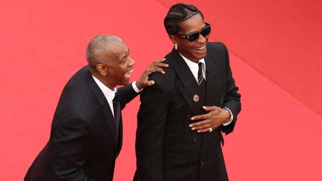 CANNES, FRANCE - MAY 19: Denzel Washington and A$AP Rocky attend the “Highest 2 Lowest” red carpet at the 78th annual Cannes Film Festival at Palais des Festivals on May 19, 2025 in Cannes, France.