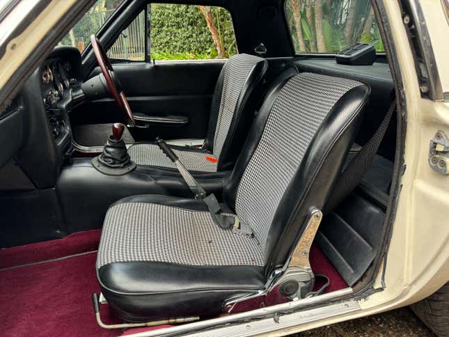The black houndstooth seats of a Mazda Cosmo 110S