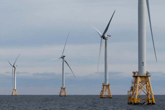 The five turbines of Block Island Wind Farm operate, Thursday, Dec. 7, 2023, off the coast of Block Island, R.I., during a tour of the North Fork Wind farm organized by Orsted. (AP Photo/Julia Nikhinson)