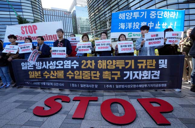 Members of civic groups stage a rally to demand the stop of the Japan&#39;s release of treated radioactive water from the damaged Fukushima nuclear power plant into ocean, in front of a building which houses Japanese Embassy, in Seoul, South Korea, Thursday, Oct. 5, 2023. The signs read &quot;Oppose to release the second radioactive water into ocean.&quot; (AP Photo/Ahn Young-joon)