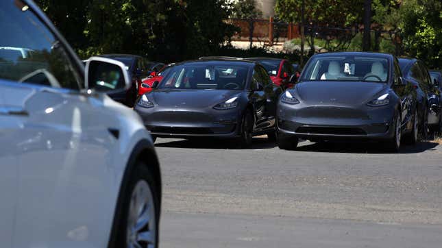 Brand new Tesla cars sit in a parking lot at a Tesla showroom on June 27, 2022 in Corte Madera, California